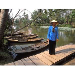 Woman Near Old Boats, Mekong Delta, Vietnam Premium 