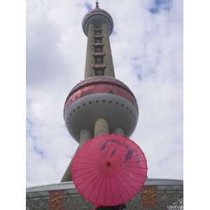China, Shanghai, Girl with Red Umbrella with Oriental Pearl Tv Tower 