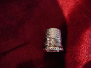 THIS IS A BEAUTIFUL VINTAGE STERLING SILVER THIMBLE. SIGNED STERLING 
