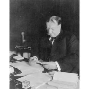  1909 photo Taft, President reading at desk in White House 