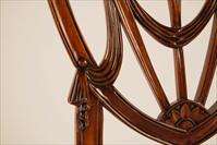 Sweetheart dining room chairs with swag carving details shown here