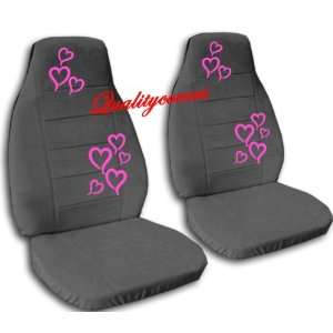 2 charcoal front seat covers with hot pink hearts. 2002 Mini 