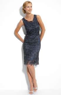 Tonal beading adds shimmer to an ornate lace tank dress with a light 