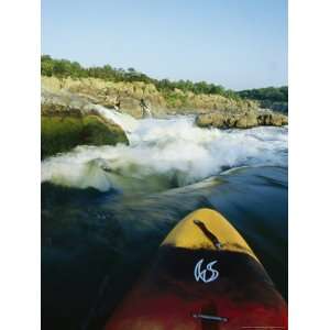 Kayak Noses its Way Toward a Waterfall and Rocks Near Great Falls 