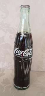 1980 16 oz. Full Green Glass Coca Cola Bottle, NY  