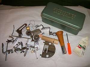Vintage Green Metal Sewing Machine Accessories plus feet screwdriver 